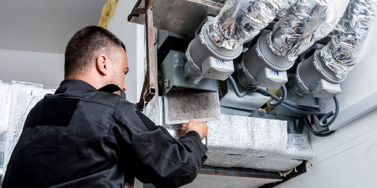 man at HVAC system