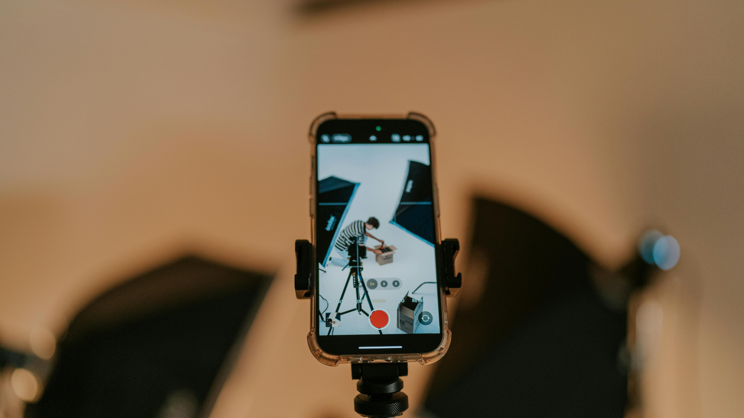 person recording on iphone