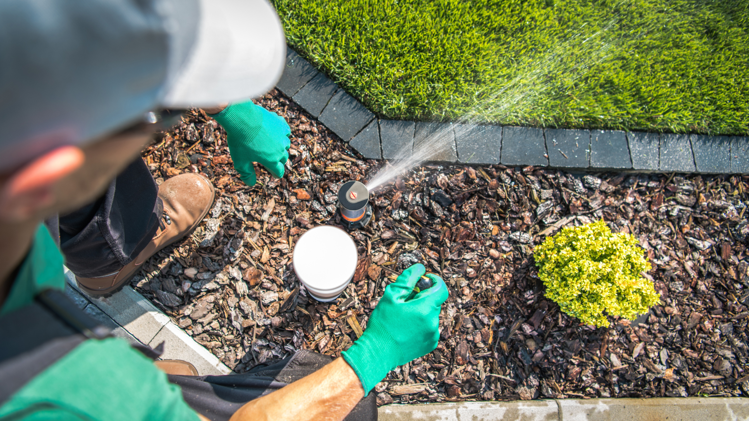 landscaper working on irrigation system